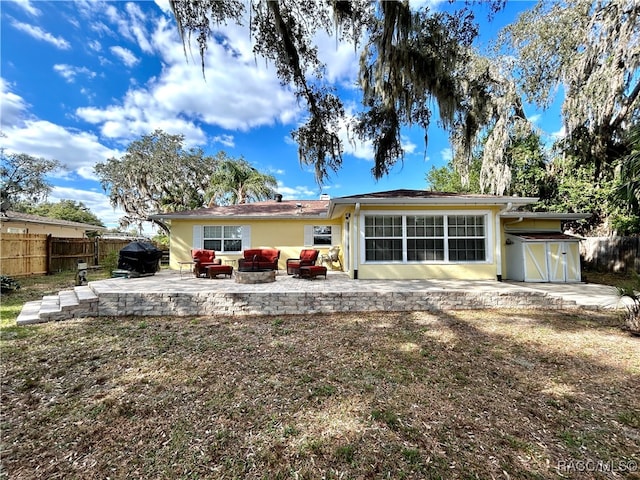 back of house featuring a patio and an outdoor hangout area