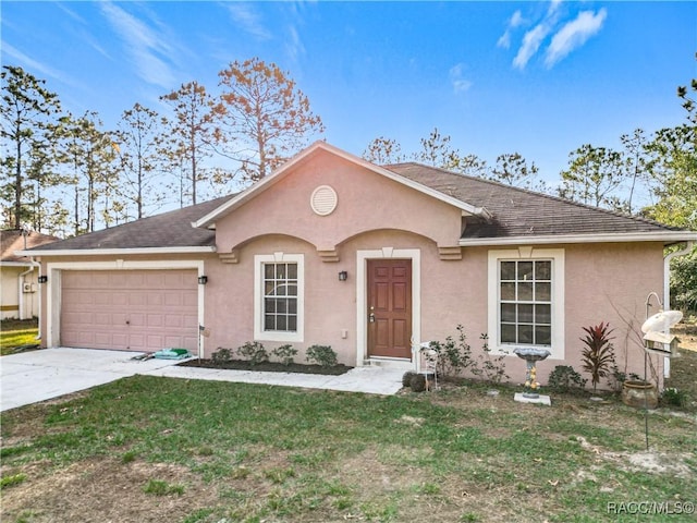 single story home with a front yard and a garage