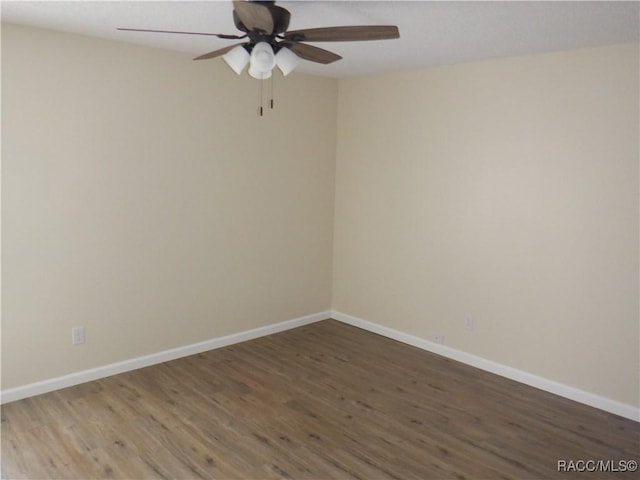 empty room with ceiling fan and wood-type flooring