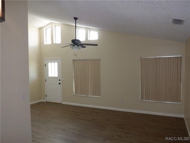 foyer entrance with ceiling fan, high vaulted ceiling, dark hardwood / wood-style floors, and a textured ceiling