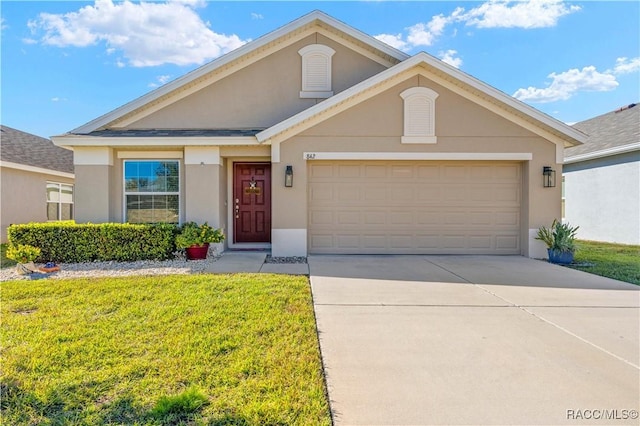 view of front of house with a front yard and a garage