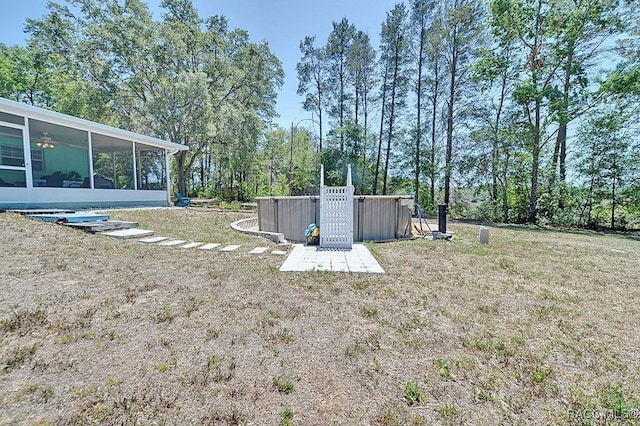 view of yard featuring a sunroom