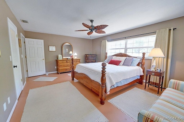 bedroom featuring visible vents, baseboards, and ceiling fan