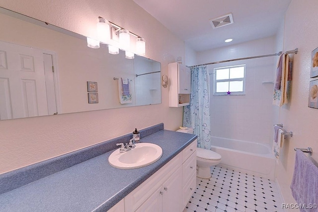bathroom with visible vents, vanity, toilet, tile patterned floors, and shower / bath combo