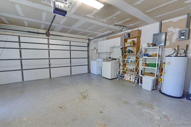 garage featuring washing machine and dryer, a garage door opener, and water heater