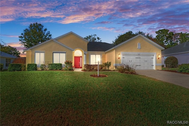 single story home with a yard and a garage