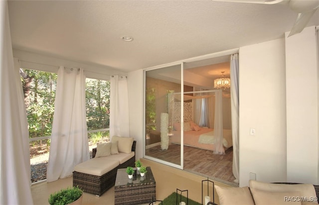 sunroom with a chandelier