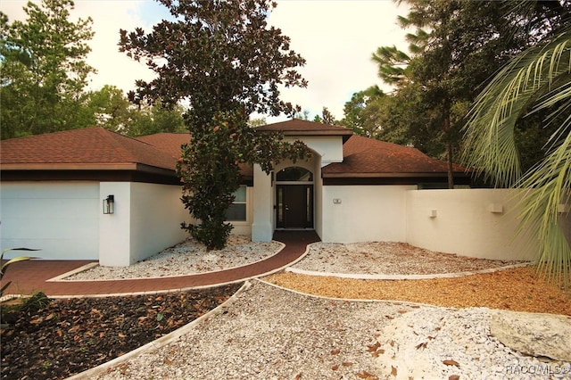 view of front of home with a garage