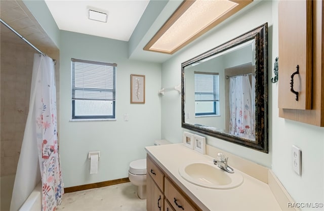 full bathroom with vanity, toilet, a wealth of natural light, and shower / tub combo with curtain