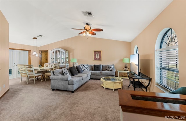 carpeted living room featuring vaulted ceiling and ceiling fan