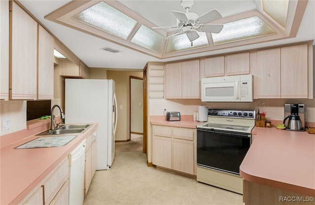 kitchen with backsplash, white appliances, ceiling fan, sink, and light brown cabinets