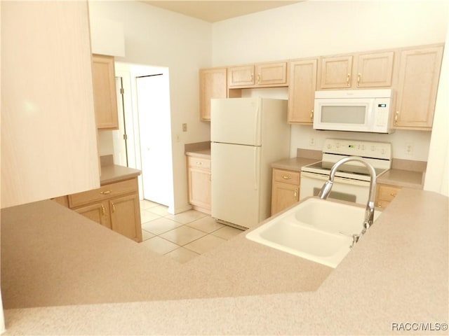 3201 N Canterbury Lake Dr, Hernando, FL 34442 - kitchen with white appliances, light brown cabinetry, a sink, light countertops, and light tile patterned flooring