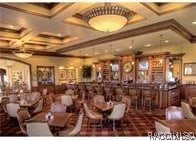 3201 N Canterbury Lake Dr, Hernando, FL 34442 - dining area with coffered ceiling, beamed ceiling, and crown molding