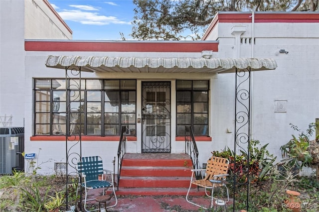 doorway to property with central AC