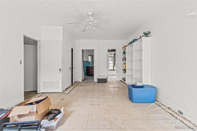 interior space featuring ceiling fan