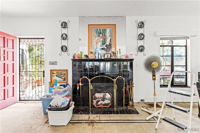 living room with a tile fireplace