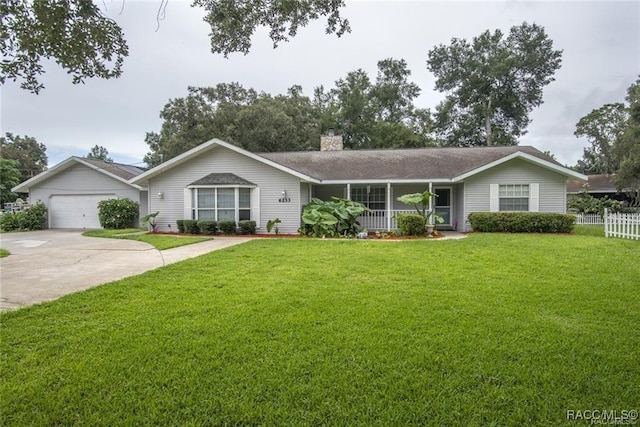 single story home with a front lawn, a porch, and a garage