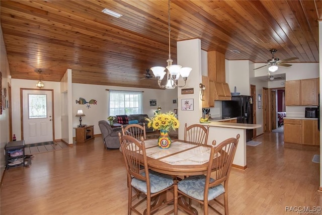 dining space featuring vaulted ceiling, wood ceiling, ceiling fan with notable chandelier, and light hardwood / wood-style floors