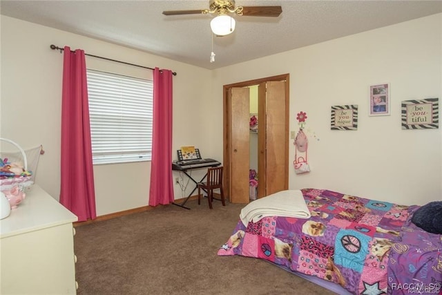 bedroom featuring dark colored carpet and ceiling fan