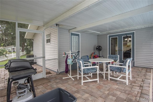 view of patio / terrace featuring a grill and french doors