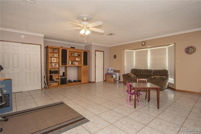 tiled living room with crown molding, ceiling fan, and a textured ceiling