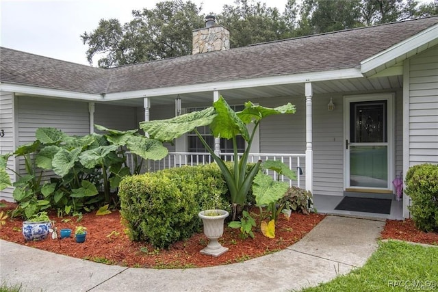 property entrance featuring covered porch