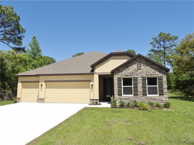 view of front of home with stucco siding, an attached garage, concrete driveway, and a front lawn