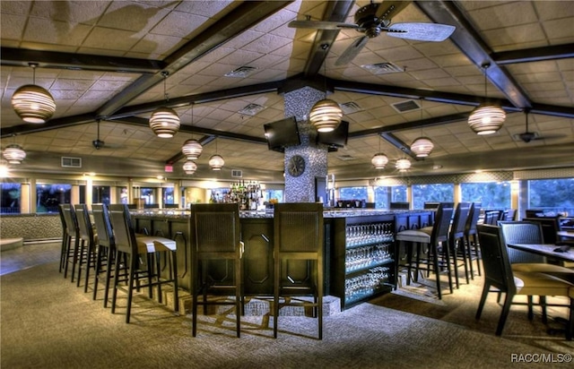 bar with carpet floors and vaulted ceiling