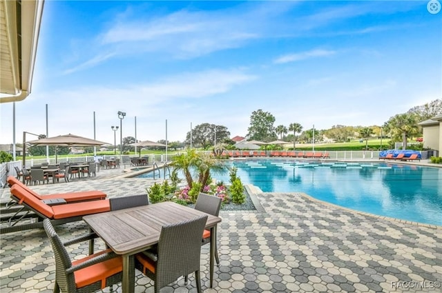 view of swimming pool featuring a patio area