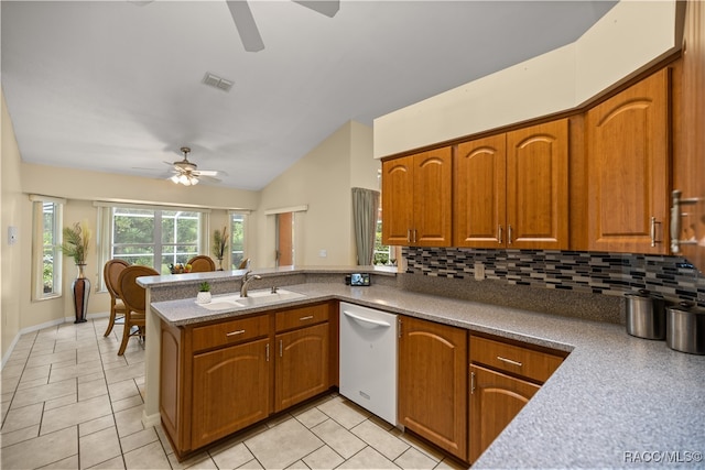 kitchen featuring kitchen peninsula, tasteful backsplash, ceiling fan, sink, and dishwasher