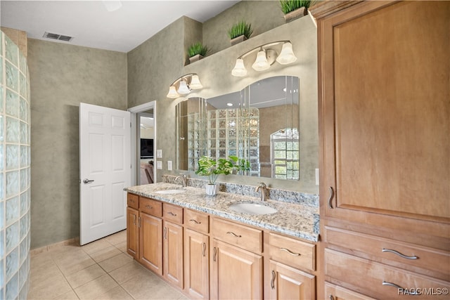 bathroom featuring tile patterned flooring and vanity