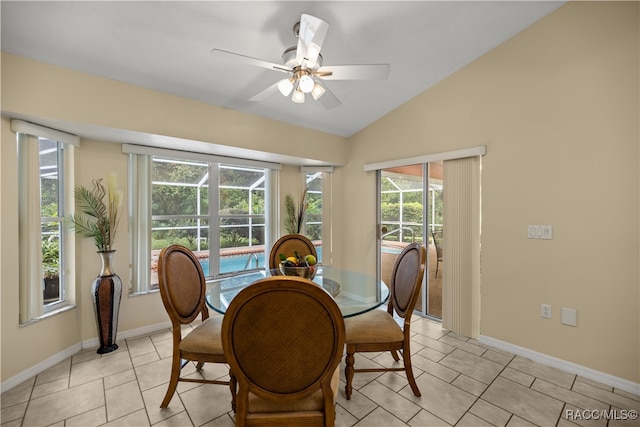 dining area with light tile patterned floors, ceiling fan, and lofted ceiling