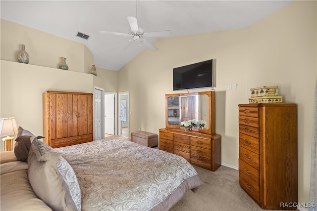 carpeted bedroom featuring ceiling fan, lofted ceiling, and a closet