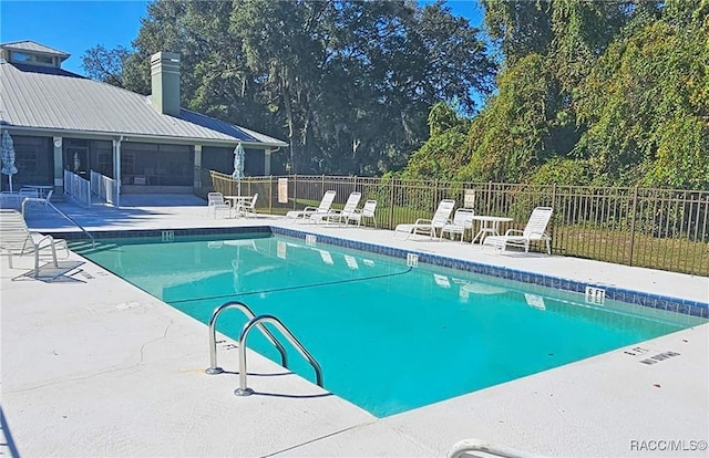 view of pool featuring a patio area