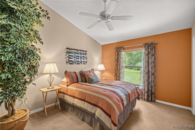 carpeted bedroom with ceiling fan and lofted ceiling