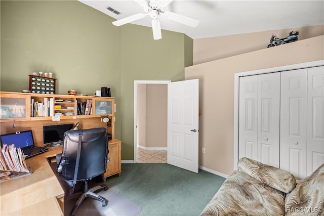 office area with ceiling fan, light carpet, and vaulted ceiling