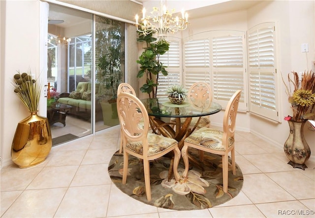 tiled dining room with a notable chandelier