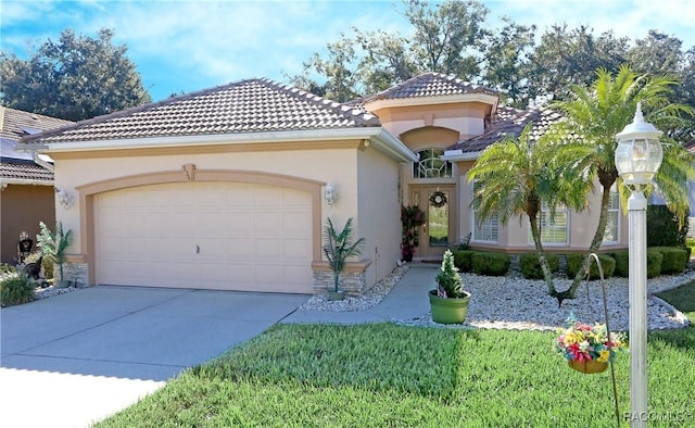 mediterranean / spanish-style house with a front lawn and a garage