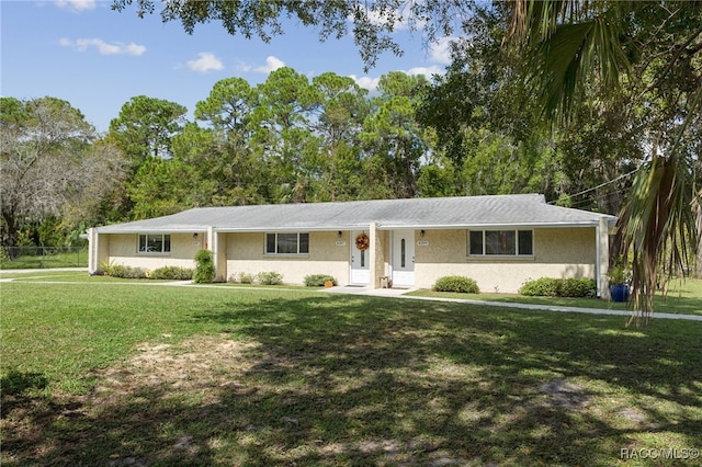 ranch-style house with a front lawn