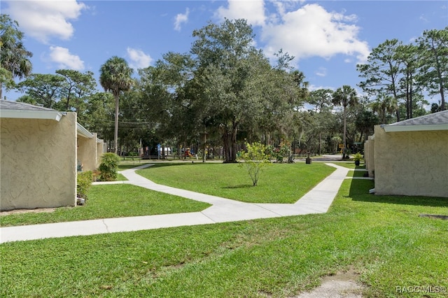 view of home's community with a lawn