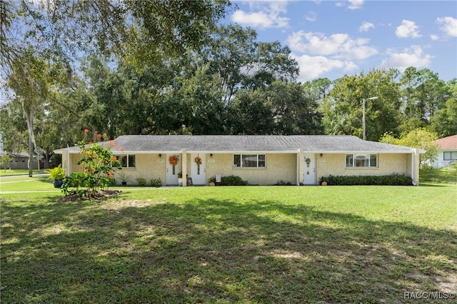 ranch-style house with a front yard