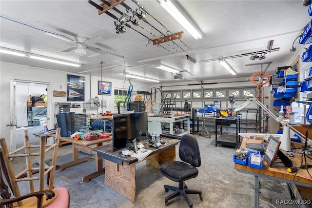 home office featuring concrete flooring, a textured ceiling, a workshop area, and ceiling fan