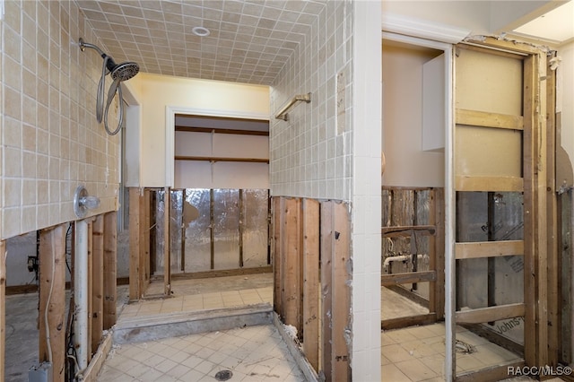 bathroom with tile walls