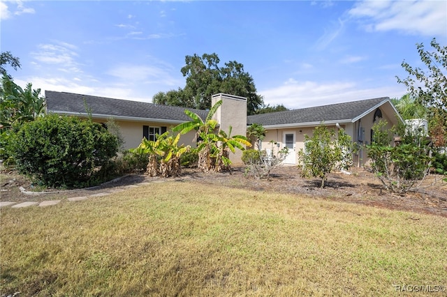 ranch-style home featuring a front yard