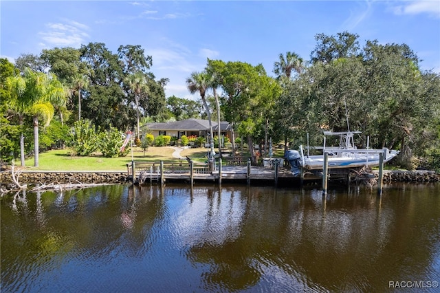 dock area with a water view and a lawn