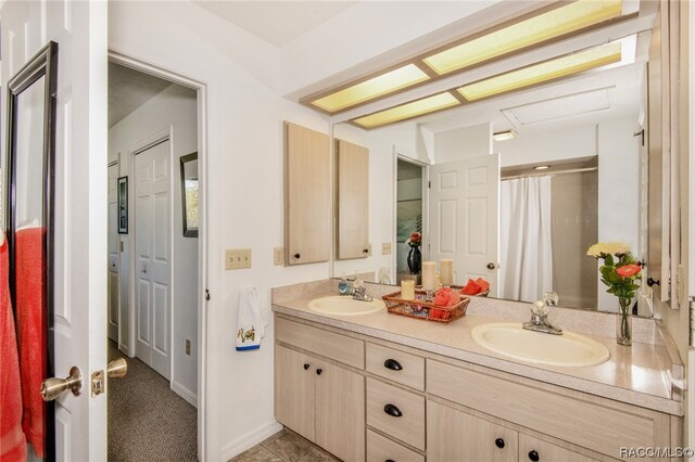 bathroom with vanity and walk in shower