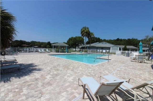 view of pool featuring a patio area