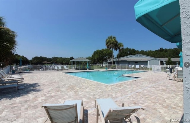 view of swimming pool featuring a patio