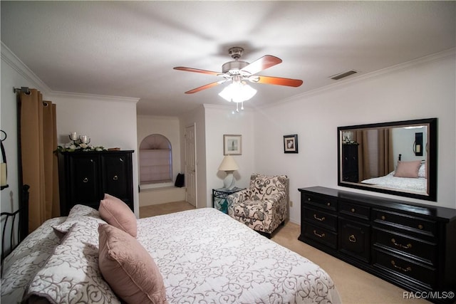 bedroom with ceiling fan, light colored carpet, and crown molding