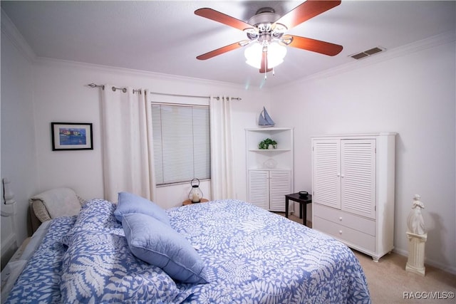 carpeted bedroom featuring ceiling fan and ornamental molding